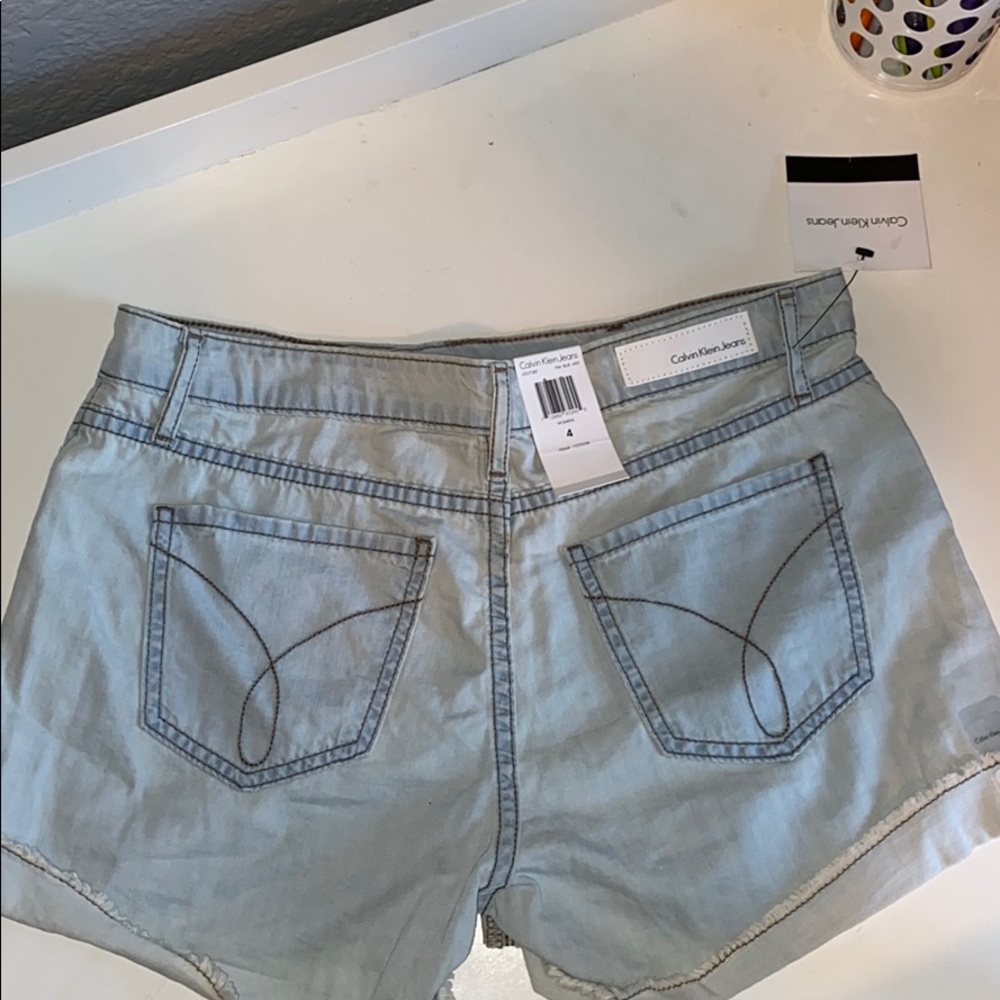 Calvin Klein light wash jean shorts